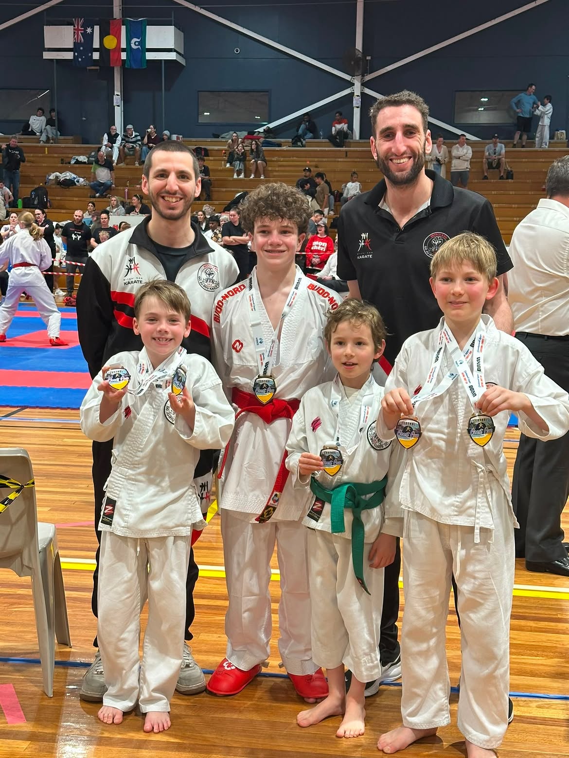 Sensei Richi and Sensei Yoni with junior tournament medalists